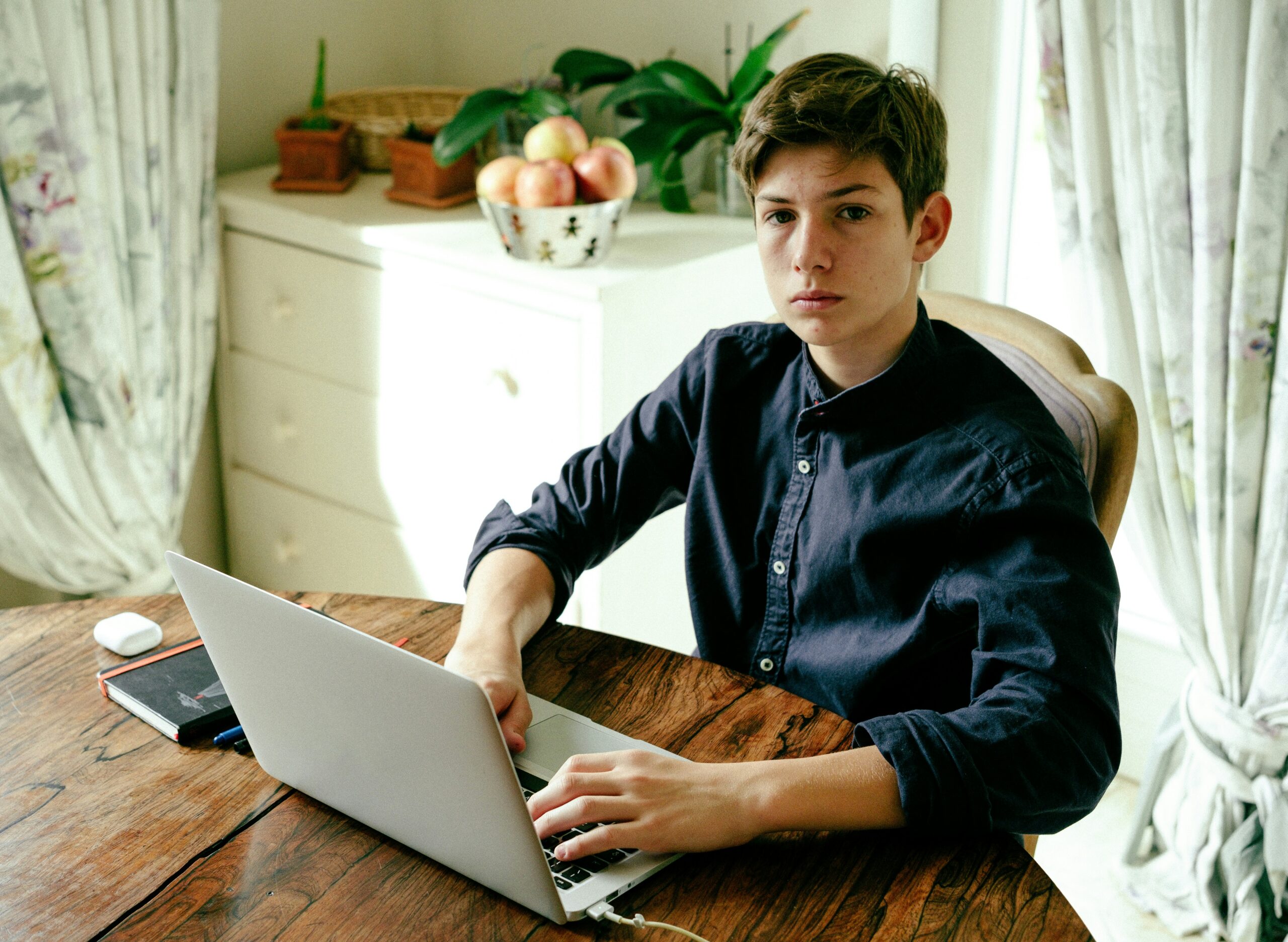 Young person sat at laptop