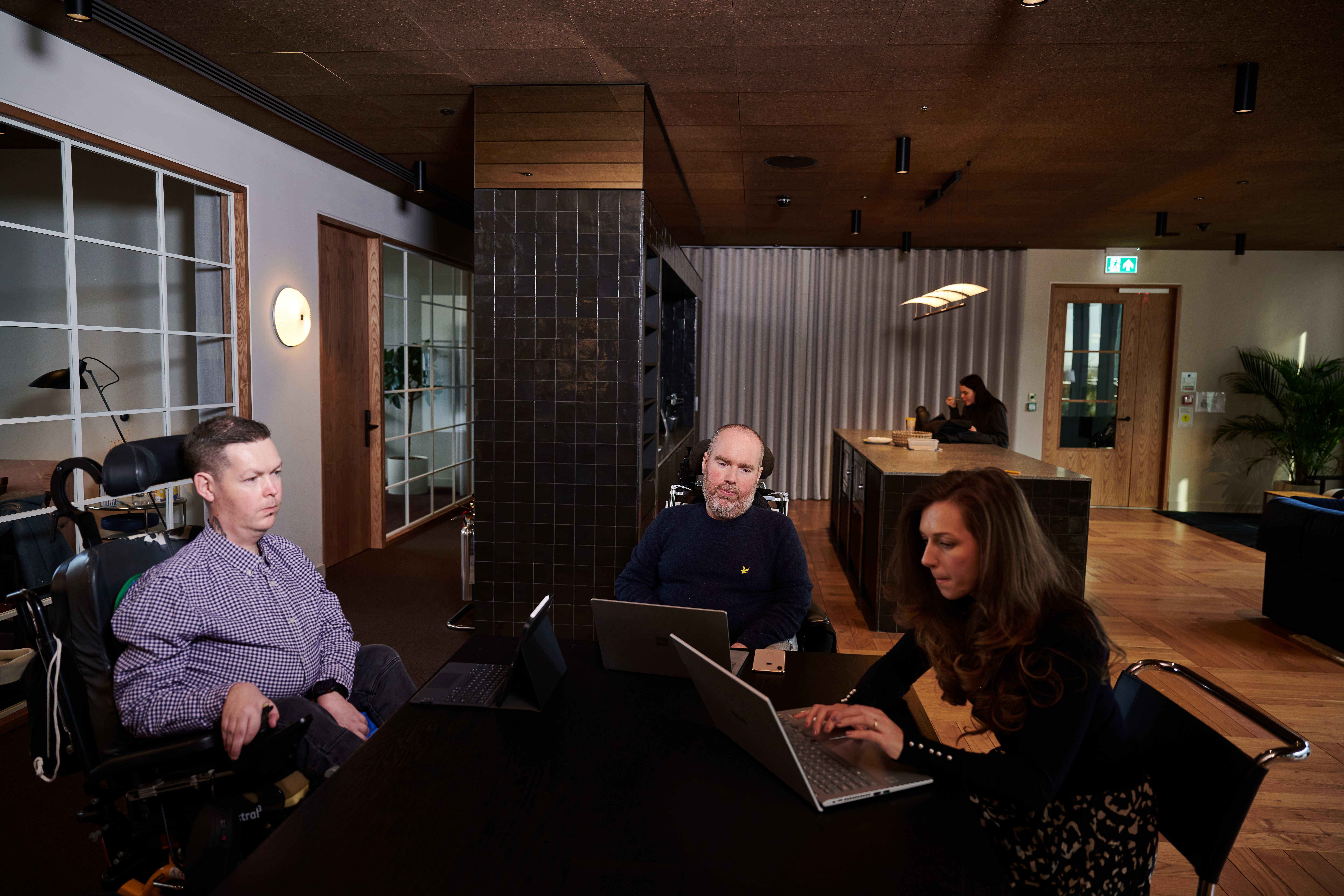 Luis, Toby and Brooklyn working together at a table
